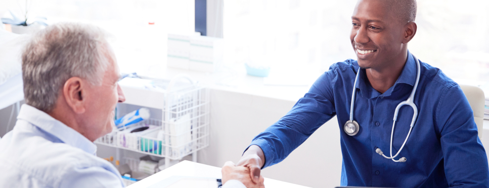 Care provider and doctor shaking hands