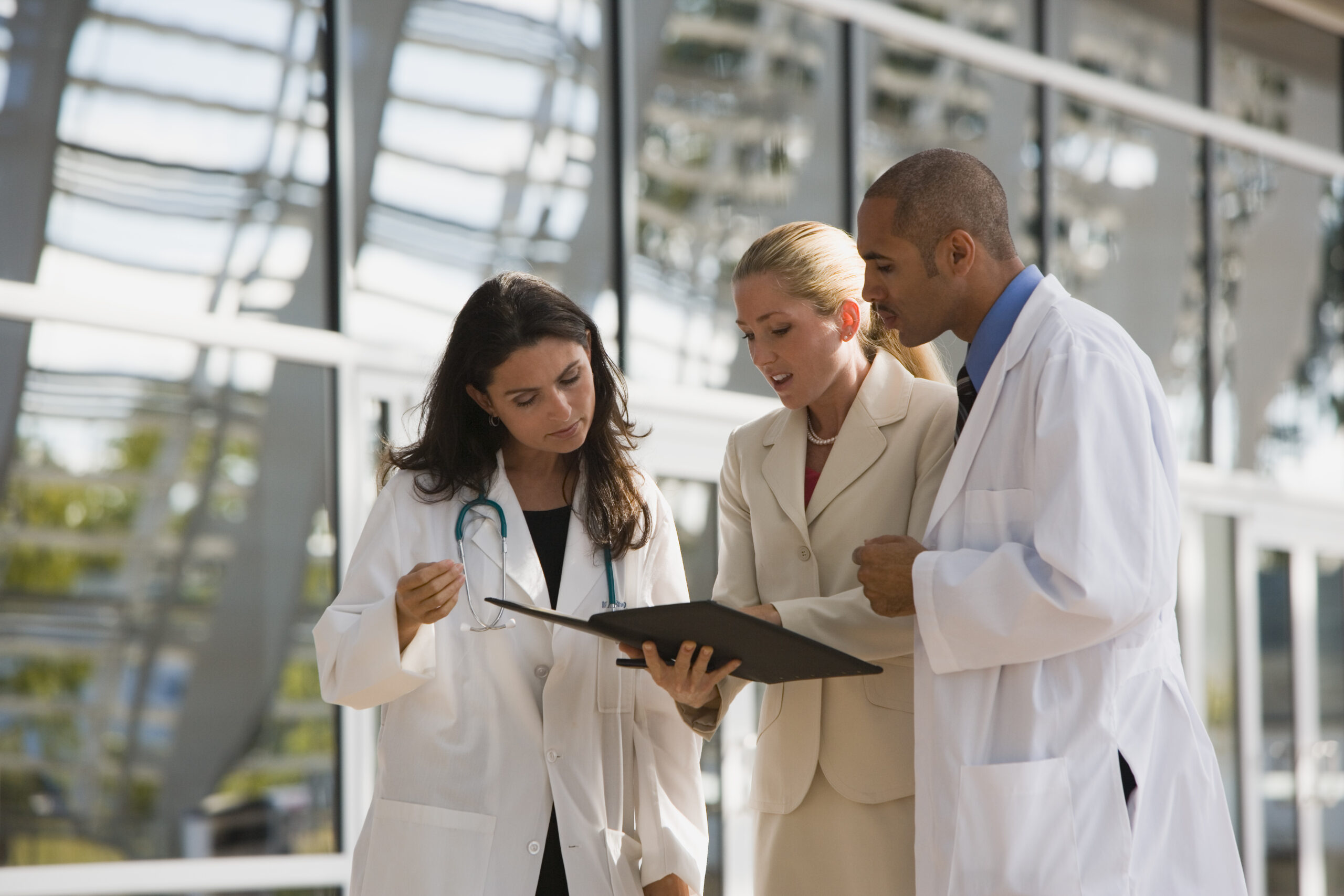 Doctors discussing a document